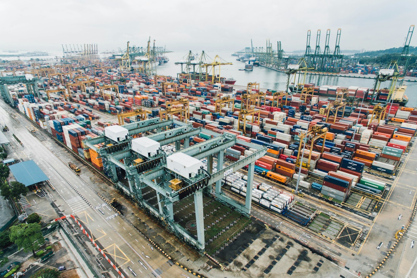 Logistics yard with containers and trucks